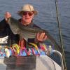 Steve Key with another gorgeous Ninigret Pond striper caught in May during the worm hatch.
