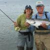 Molly Semenik of Livingston, MT caught some nice stripers in skinny water in Newport
