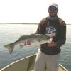 Pete Kutzer with one of countless stripers he caught in the shallows of Little Narragansett Bay
