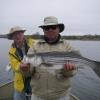 MIke Urbanic holding his first striped bass with his friend Steve Key looking over his shoulder. Rest in Peace Mike
